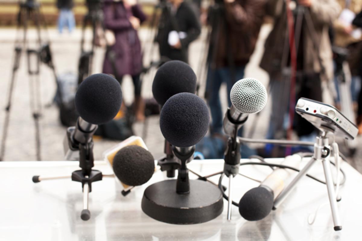 Microphones at a news conference